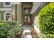 Charming front entrance with double doors, well-maintained landscaping, and exterior lighting at 490 Wekiva Preserve Dr, Apopka, FL 32712