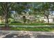 Charming two-story home featuring a well-manicured lawn and mature landscaping at 490 Wekiva Preserve Dr, Apopka, FL 32712
