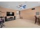 Spacious living room with entertainment center and bar seating provides ample space for relaxing and gathering at 490 Wekiva Preserve Dr, Apopka, FL 32712