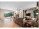 Comfortable living room offering pool view with a cozy fireplace and built-in shelving at 490 Wekiva Preserve Dr, Apopka, FL 32712