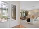 Inviting entryway with decorative glass doors leading to a beautifully furnished living room at 490 Wekiva Preserve Dr, Apopka, FL 32712