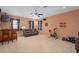 Cozy living room with comfortable seating and fan, offers a relaxing space for exercise and entertainment at 490 Wekiva Preserve Dr, Apopka, FL 32712