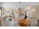 Open-concept living and dining room features stylish furniture, decor, and natural light at 490 Wekiva Preserve Dr, Apopka, FL 32712