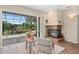 Bright living room featuring a cozy fireplace and a sliding glass door leading to the screened pool and patio at 490 Wekiva Preserve Dr, Apopka, FL 32712
