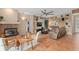 Spacious living room with a fireplace, built-in bookshelves, and neutral-toned tile flooring at 490 Wekiva Preserve Dr, Apopka, FL 32712