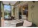 Screened patio with comfortable seating, ceiling fan and sliding glass doors offer seamless indoor-outdoor living at 490 Wekiva Preserve Dr, Apopka, FL 32712