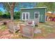 Private backyard with detached bonus space and ample outdoor seating, surrounded by mature trees at 5032 Timber Ridge Trl, Ocoee, FL 34761