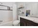 Well-maintained bathroom with a shower-tub combo, and a sink with lots of storage underneath at 5032 Timber Ridge Trl, Ocoee, FL 34761