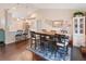 Bright dining area featuring hardwood floors, a large dining table, and stylish decor at 5032 Timber Ridge Trl, Ocoee, FL 34761