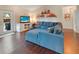 Inviting living room featuring hardwood floors, a comfortable sofa, and stylish decor at 5032 Timber Ridge Trl, Ocoee, FL 34761