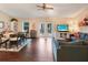 Open living space combining dining and living areas with hardwood floors and ample natural light at 5032 Timber Ridge Trl, Ocoee, FL 34761