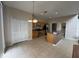 Kitchen view with stainless steel appliances, island, and adjacent half bathroom at 6024 Chapledale Dr, Orlando, FL 32829