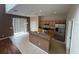 Open kitchen features an island, stainless steel appliances, and tile flooring at 6024 Chapledale Dr, Orlando, FL 32829