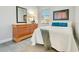 Comfortable bedroom with wood flooring, dresser, and neutral decor at 608 Ashwell Ct, Debary, FL 32713