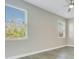 Bedroom with neutral walls, large windows, blinds, and modern ceiling fan at 608 Ashwell Ct, Debary, FL 32713