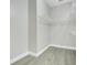 Walk-in closet with wire shelving and gray flooring at 608 Ashwell Ct, Debary, FL 32713