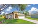 Charming single-story home with well-kept lawn, arched doorway, and convenient garage at 608 Ashwell Ct, Debary, FL 32713