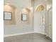 Bright foyer features neutral walls, hardwood floors, and decorative recessed alcoves at 608 Ashwell Ct, Debary, FL 32713
