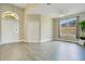 Open-plan living room with modern gray floors, high ceilings, and natural light at 608 Ashwell Ct, Debary, FL 32713