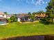 Aerial view showcasing the property's backyard pool, lush landscaping, and overall serene setting at 641 Lakescape Ct, Orlando, FL 32828