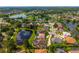 Wide aerial view of home surrounded by lush landscaping and community ponds at 641 Lakescape Ct, Orlando, FL 32828