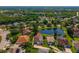Attractive aerial view showcases a neighborhood with lush landscaping and a tranquil lake at 641 Lakescape Ct, Orlando, FL 32828