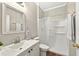 Clean bathroom featuring a shower, white fixtures, and ample lighting at 641 Lakescape Ct, Orlando, FL 32828