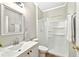 Clean bathroom featuring a shower, white fixtures, and ample lighting at 641 Lakescape Ct, Orlando, FL 32828