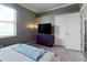 This bedroom has a large window and a closet with white doors at 641 Lakescape Ct, Orlando, FL 32828