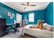 Cozy bedroom featuring blue walls, a ceiling fan, carpet floors, and desk at 641 Lakescape Ct, Orlando, FL 32828