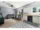 Finished bonus room featuring vinyl patterned floors, white cabinets, and gray leather sofa at 641 Lakescape Ct, Orlando, FL 32828