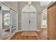 Bright foyer with double doors, a view of the office, and French doors to the living area at 641 Lakescape Ct, Orlando, FL 32828