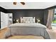 The main bedroom offers hardwood floors, soft carpet, a ceiling fan, and natural light at 641 Lakescape Ct, Orlando, FL 32828