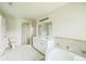 Bright bathroom features a double vanity, soaking tub, and separate shower at 657 Mckinley Ct, Kissimmee, FL 34758