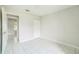 Bright bedroom features a closet and tile flooring for easy maintenance at 657 Mckinley Ct, Kissimmee, FL 34758