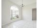 Bright dining area with a large arched window offering natural light at 657 Mckinley Ct, Kissimmee, FL 34758