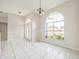 Bright entryway featuring a large arched window and tile flooring at 657 Mckinley Ct, Kissimmee, FL 34758