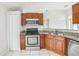 Kitchen with stainless steel appliances, granite countertops, and tiled flooring at 657 Mckinley Ct, Kissimmee, FL 34758