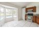 Bright kitchen with tiled flooring, stainless steel appliances and window view of pool at 657 Mckinley Ct, Kissimmee, FL 34758