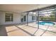 A covered patio overlooks the kidney shaped pool, offering a cool outdoor retreat at 657 Mckinley Ct, Kissimmee, FL 34758