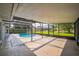 The screened in pool area looks out onto the lawn, providing privacy and protection at 657 Mckinley Ct, Kissimmee, FL 34758