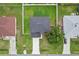 Bird's eye view of a home featuring a fenced yard and mature tree on a well-maintained lawn at 670 Bluebill Ct, Poinciana, FL 34759