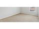 Neutral bedroom with carpet and baseboard; one window lets in natural light at 670 Bluebill Ct, Poinciana, FL 34759