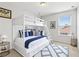 Cozy bedroom features bunk beds, playful decor, and a bright, airy atmosphere at 670 Bluebill Ct, Poinciana, FL 34759