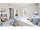Serene bedroom with blue accents, white bedding, and an inviting atmosphere with ample lighting at 670 Bluebill Ct, Poinciana, FL 34759
