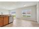 Eat-in kitchen features granite countertops, stainless steel appliances and tile flooring at 670 Bluebill Ct, Poinciana, FL 34759