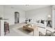 Neutrally decorated living room features a comfortable white couch and stylish decor at 670 Bluebill Ct, Poinciana, FL 34759