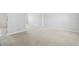 Spacious living room with neutral carpeting and light gray walls at 670 Bluebill Ct, Poinciana, FL 34759
