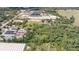 Aerial view of the property showcasing the land, greenhouses, and surrounding landscape at 6957 Plymouth Sorrento Rd, Apopka, FL 32712