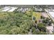 Lush, sprawling landscape featuring a mix of dense trees and open fields with two ponds at 6957 Plymouth Sorrento Rd, Apopka, FL 32712